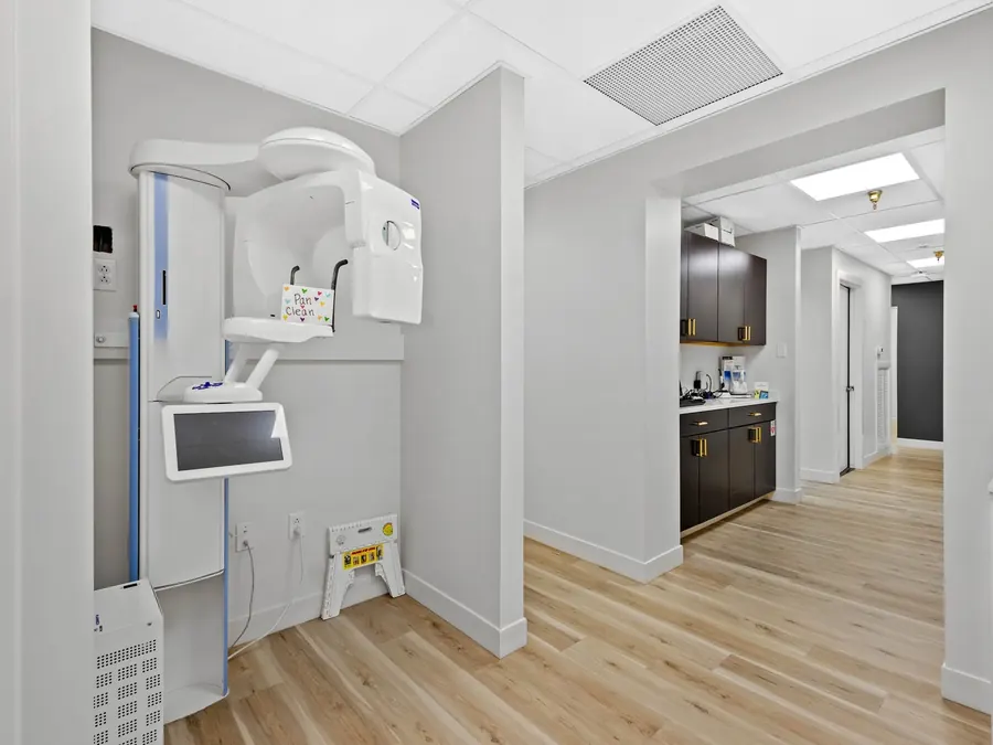 The imaging room at the Mt. Lebanon office, with an x-ray unit and a corridor to the treatment rooms.